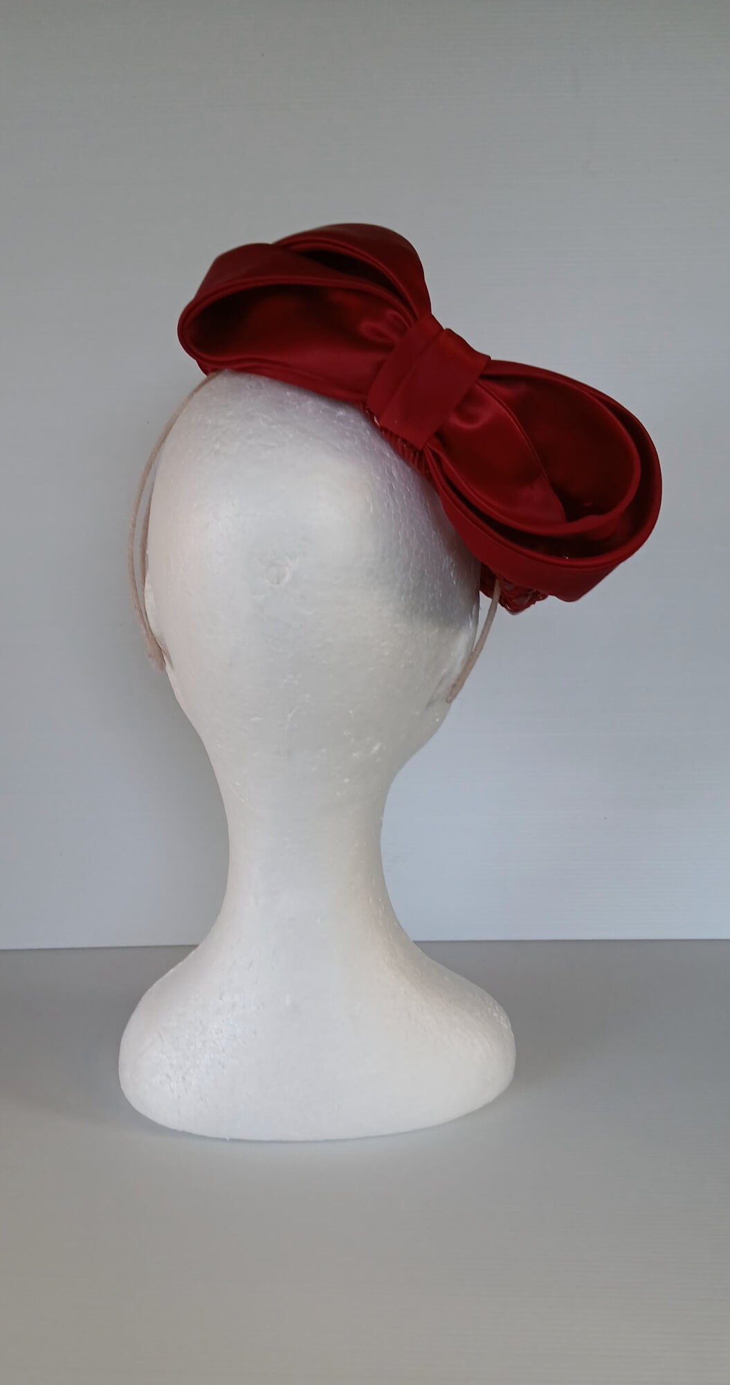 A picture of a Red Swiss Straw Braid Pillbox Hat by Melissa Rath Millinery