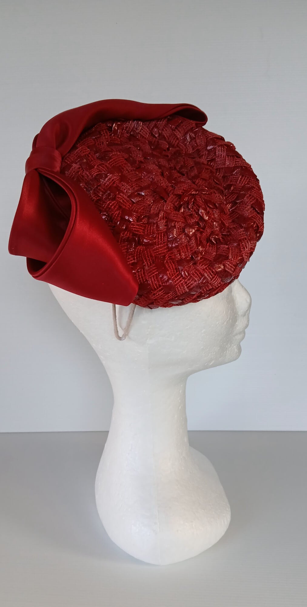 A picture of a Red Swiss Straw Braid Pillbox Hat by Melissa Rath Millinery