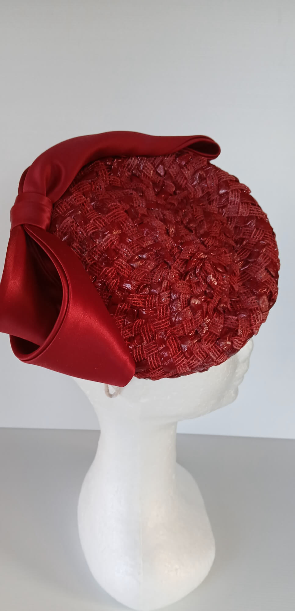 A picture of a Red Swiss Straw Braid Pillbox Hat by Melissa Rath Millinery