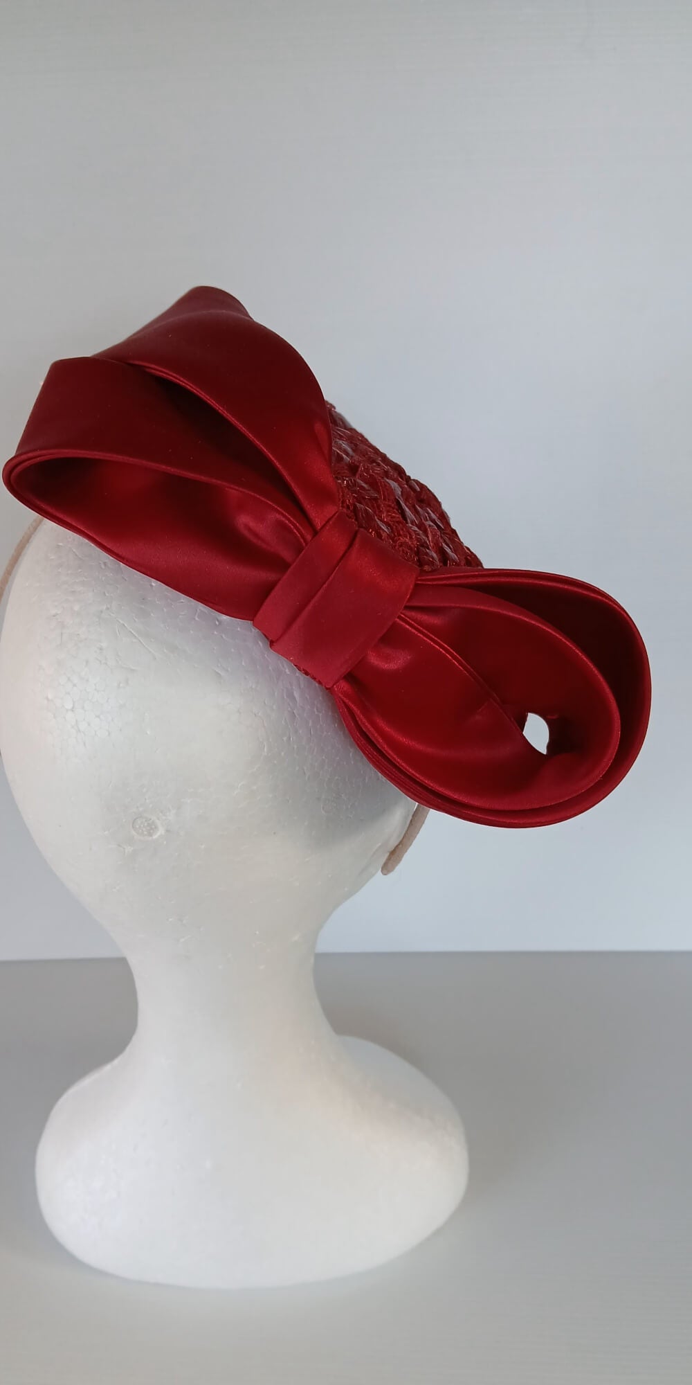 A picture of a Red Swiss Straw Braid Pillbox Hat by Melissa Rath Millinery