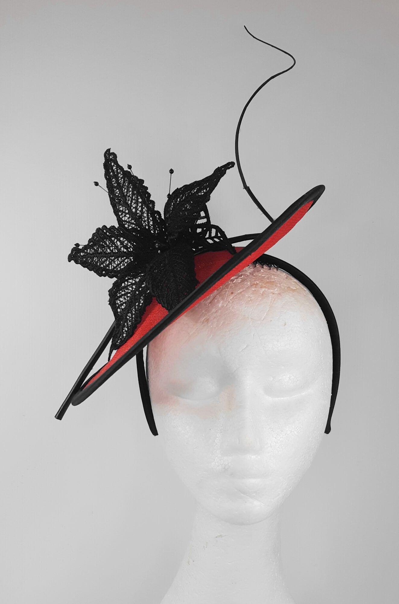 A picture of a Red and Black Saucer Hat by Melissa Rath Millinery