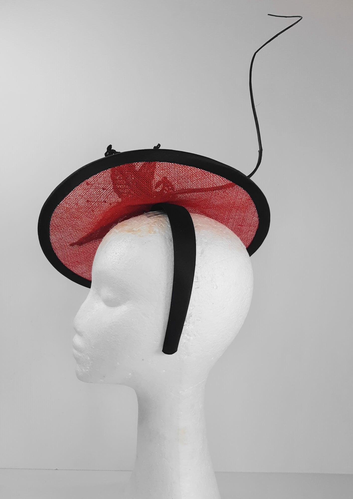 A picture of a Red and Black Saucer Hat by Melissa Rath Millinery