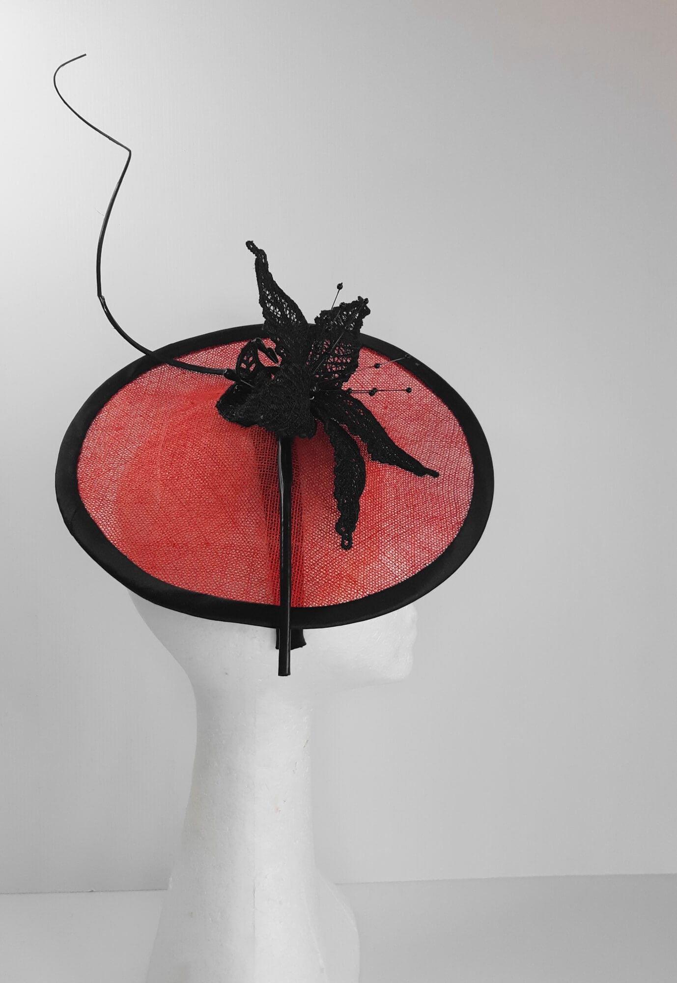 A picture of a Red and Black Saucer Hat by Melissa Rath Millinery
