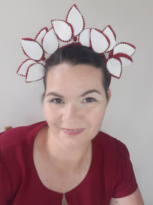 A picture of a red and white leather headband by Melissa  Rath Millinery
