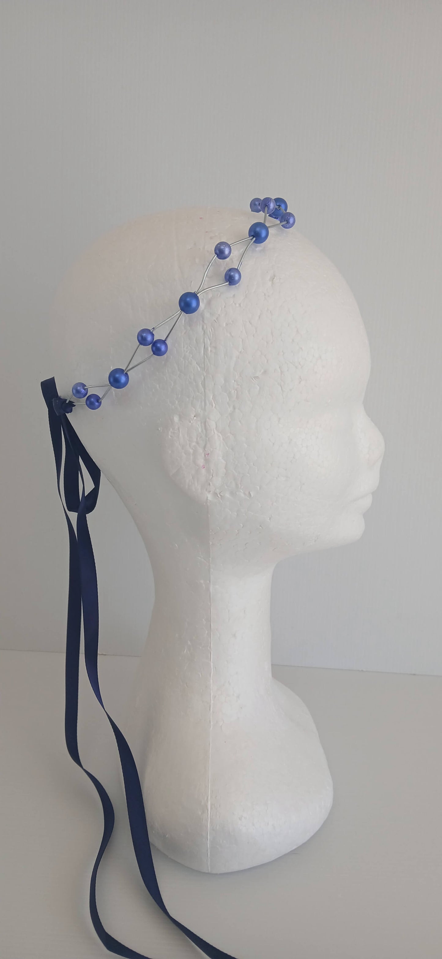An image of the Royal Blue Beaded Halo Crown by Melissa Rath Millinery