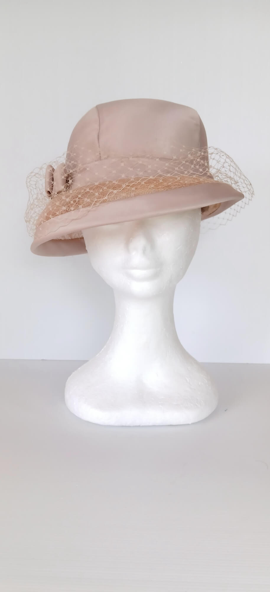 A picture of a tan hat by Melissa Rath Millinery.