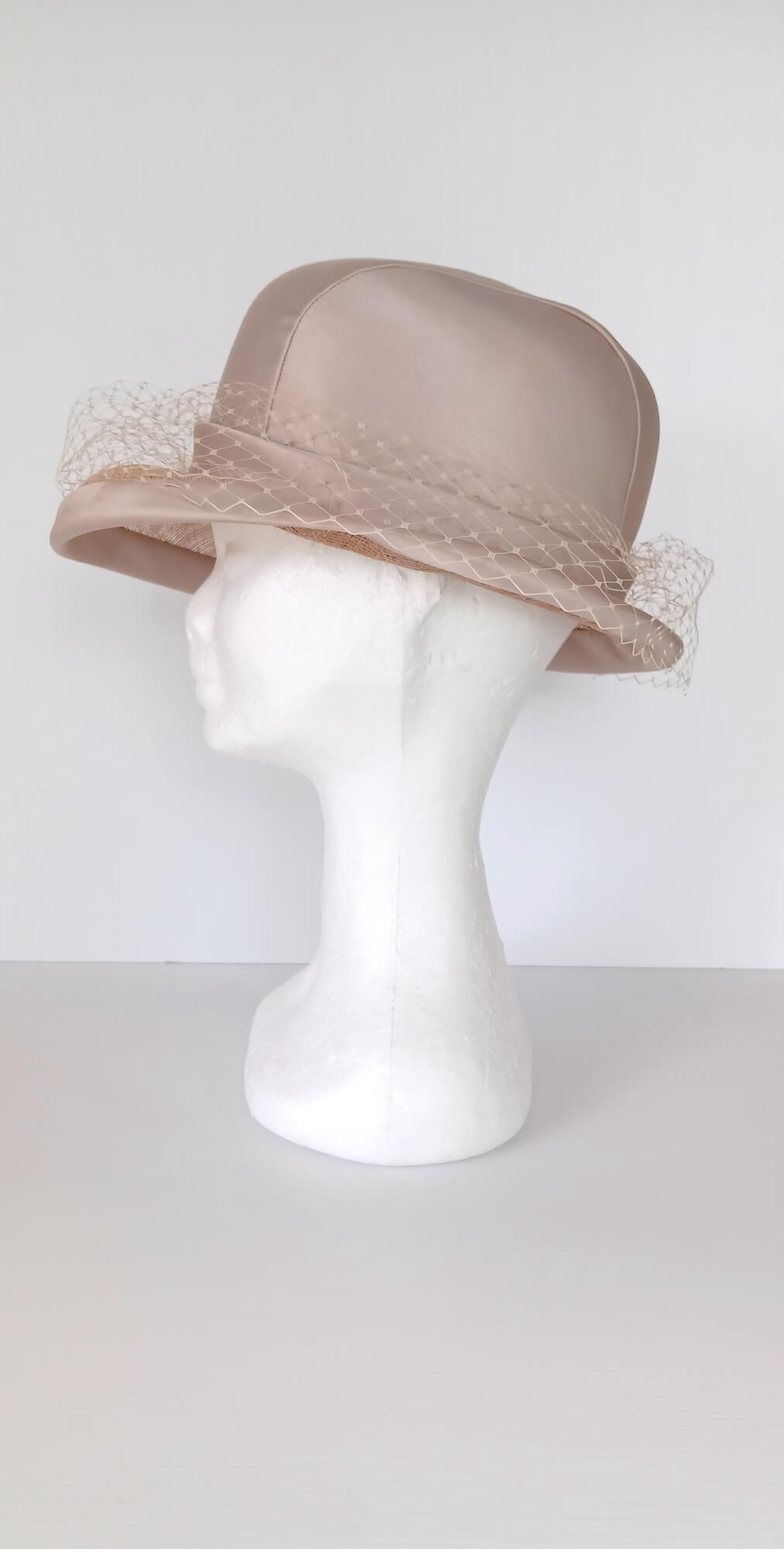 A picture of a tan hat by Melissa Rath Millinery.