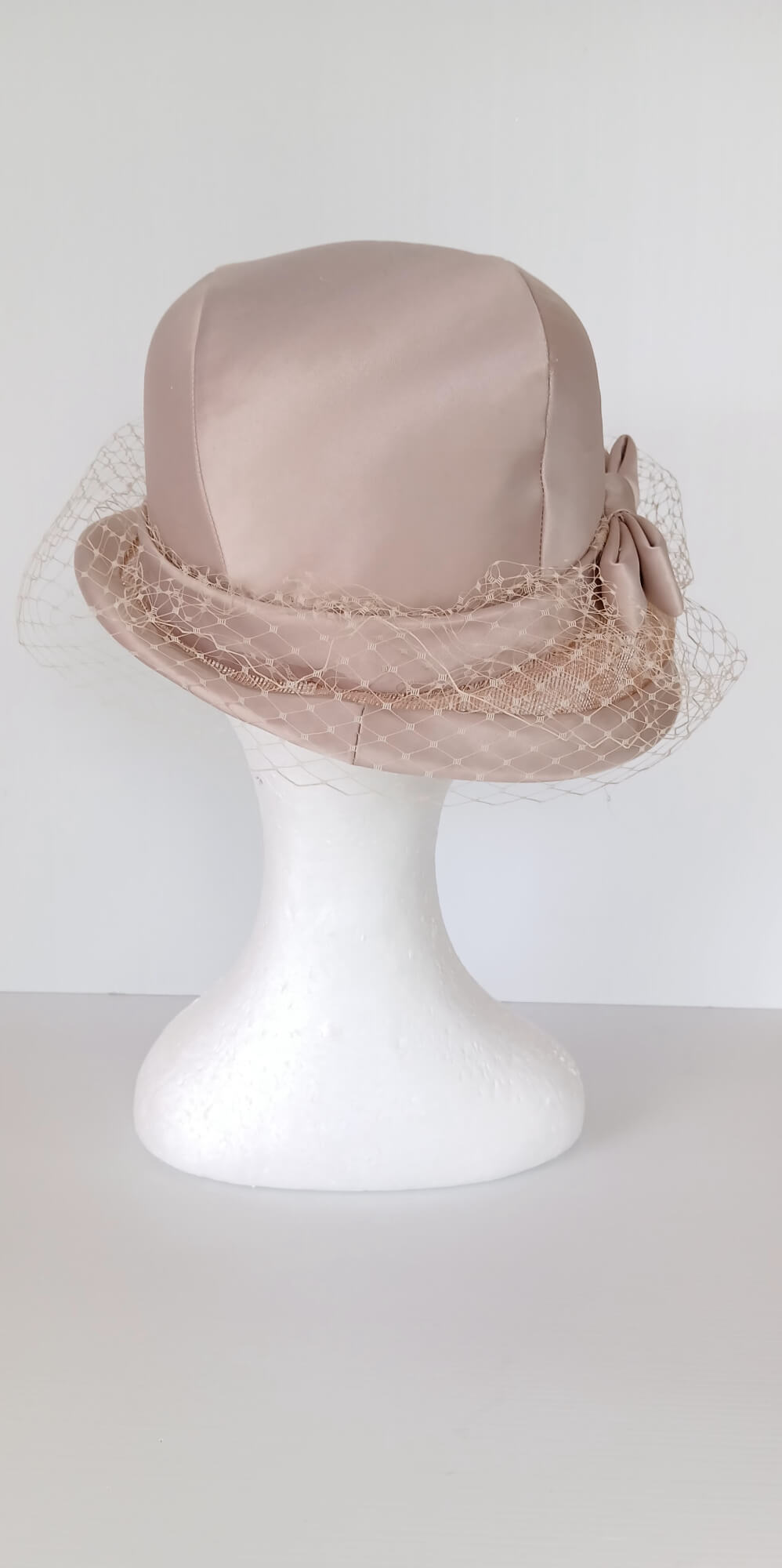 A picture of a tan hat by Melissa Rath Millinery.