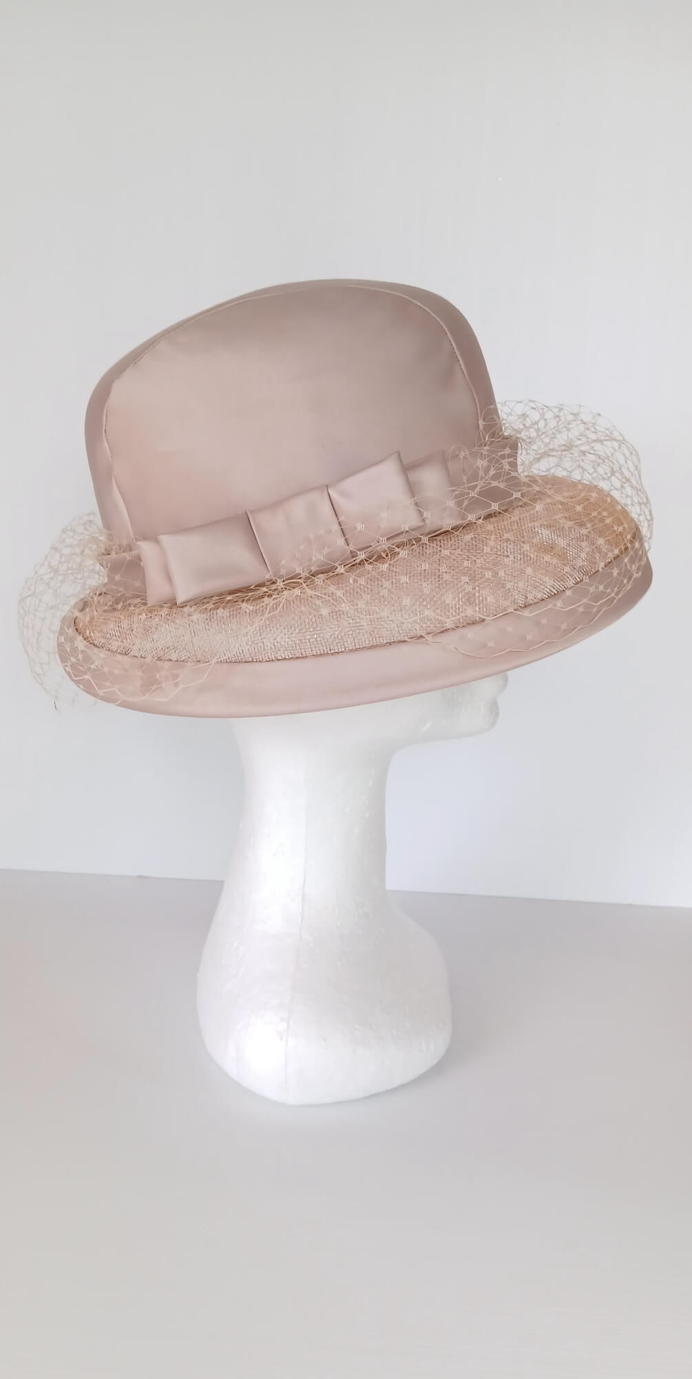 A picture of a tan hat by Melissa Rath Millinery.