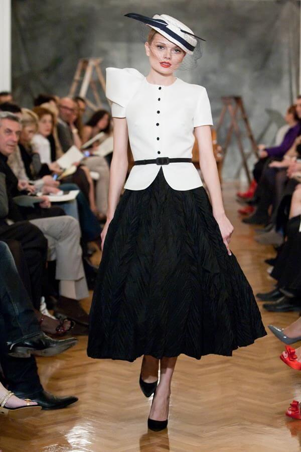 A picture of a model on the catwalk for Vassilis Emmanuel Zoulias 2011.