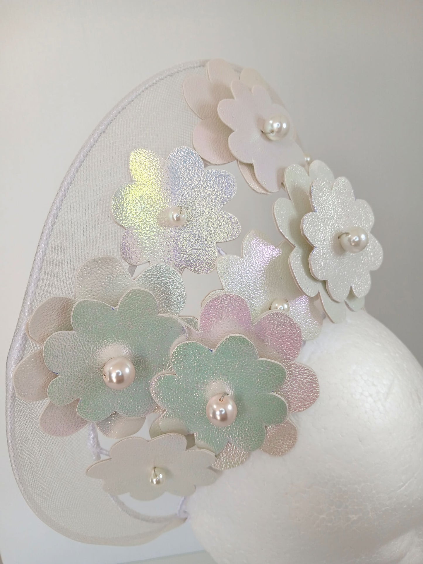A picture of a White Pleather and Crinoline Millinery Halo Crown by Melissa Rath Millinery.