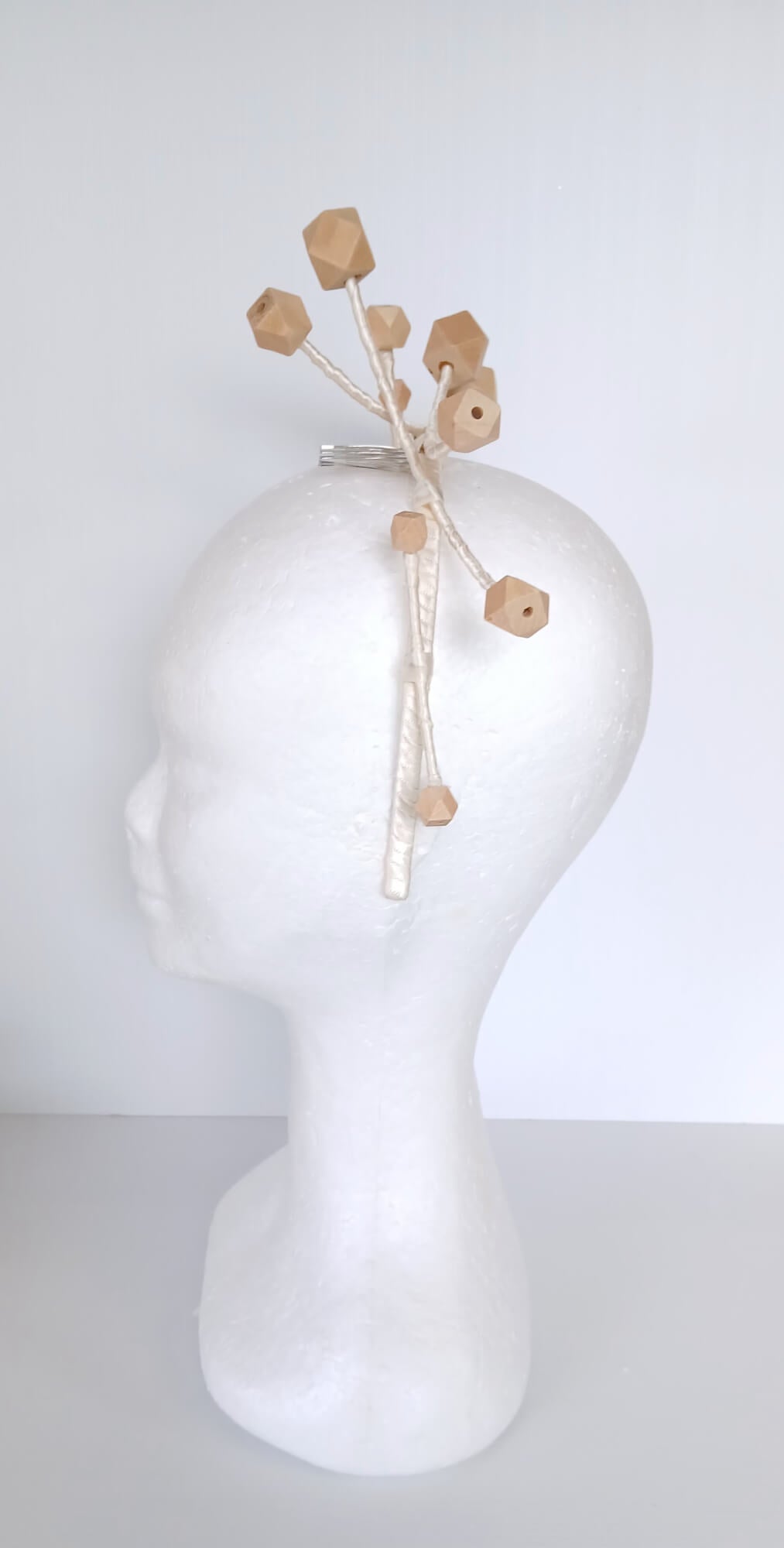 A picture of a Wooden Beaded Headband by Melissa Rath Millinery