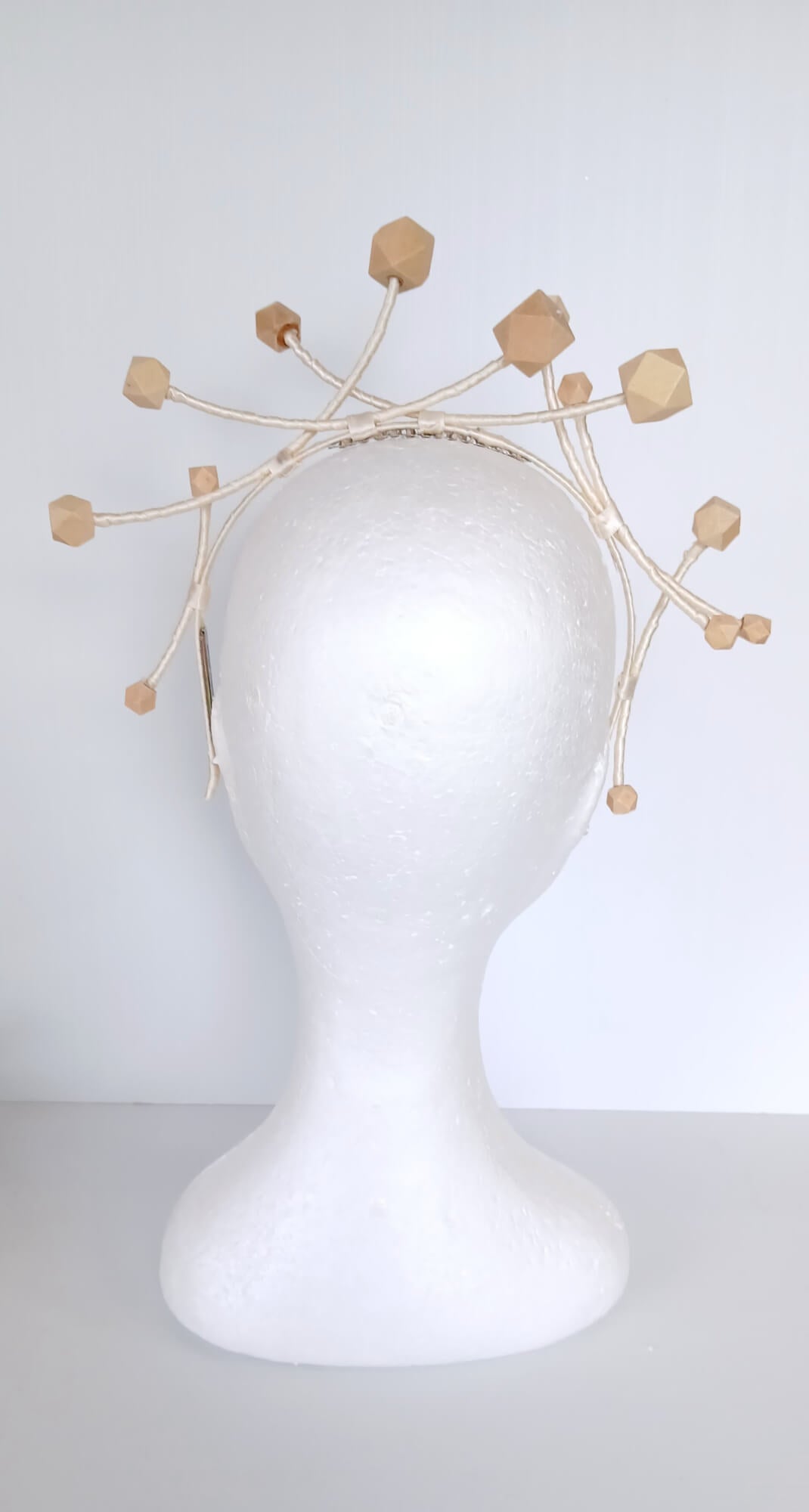A picture of a Wooden Beaded Headband by Melissa Rath Millinery