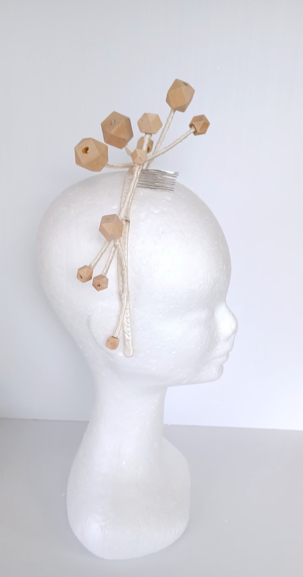 A picture of a Wooden Beaded Headband by Melissa Rath Millinery
