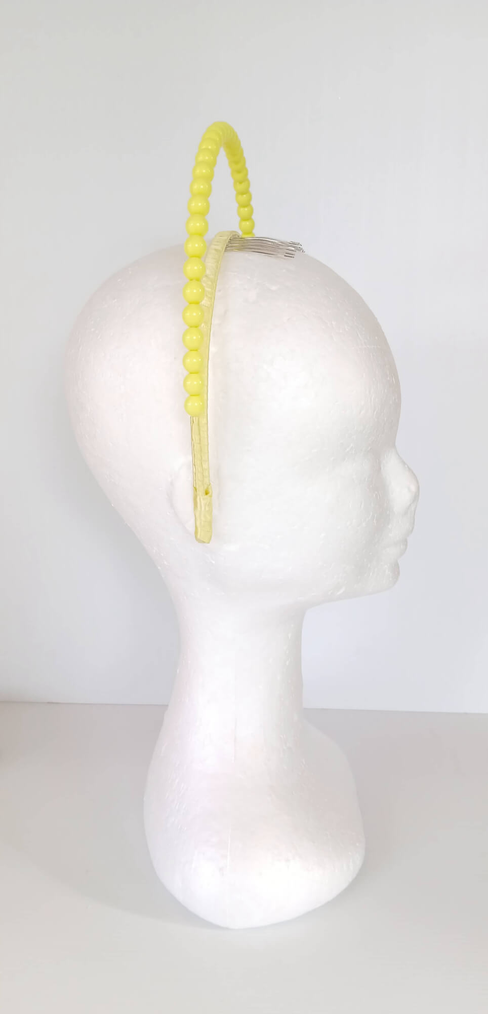 A picture of a Yellow Beaded Headband by Melissa Rath Millinery