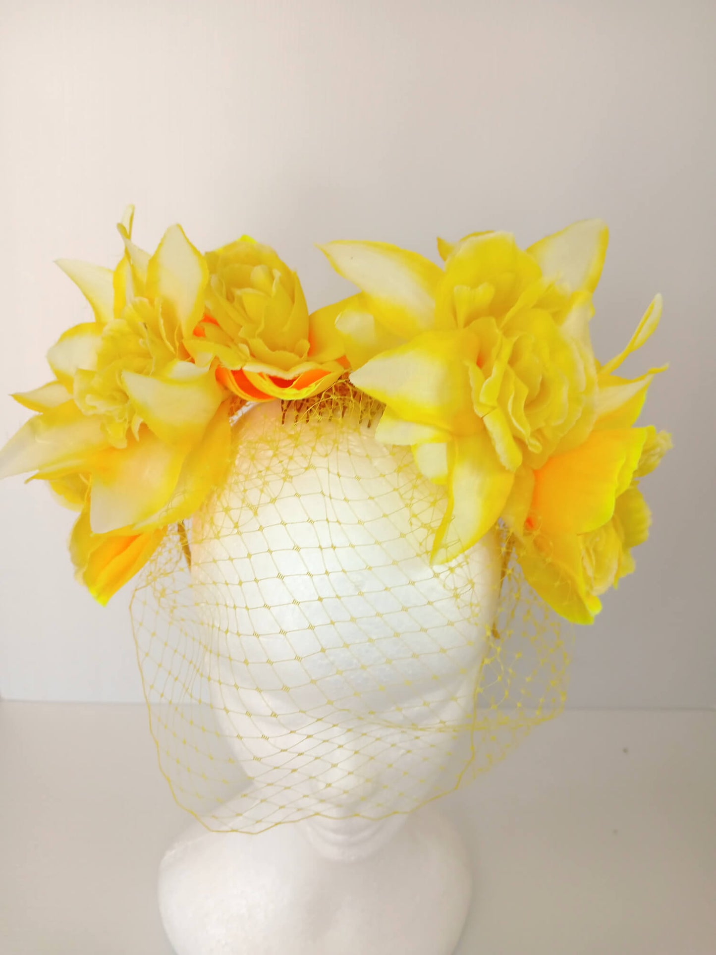 A picture of a Yellow Veiled Headband by Melissa Rath Millinery