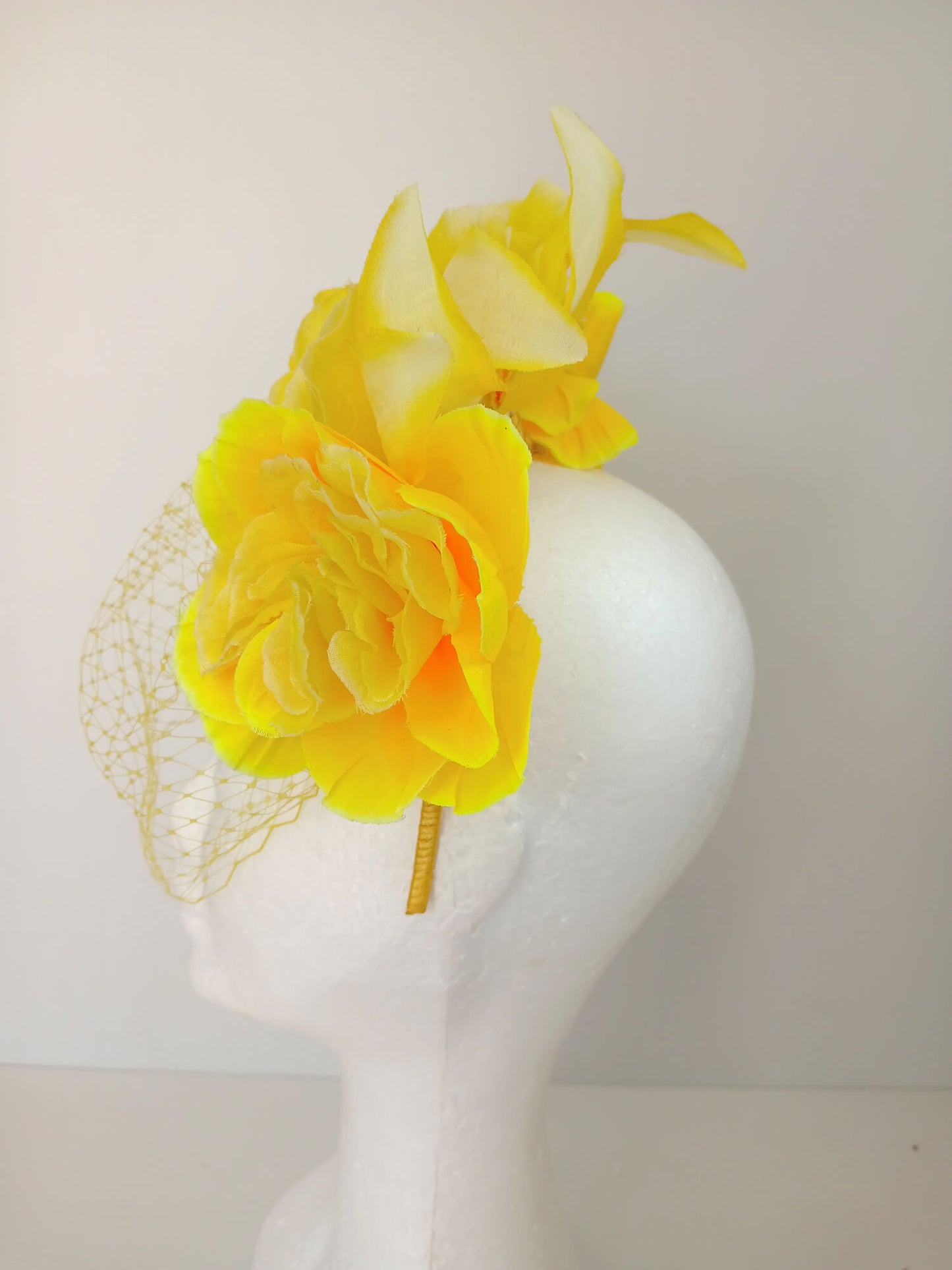 A picture of a Yellow Veiled Headband by Melissa Rath Millinery