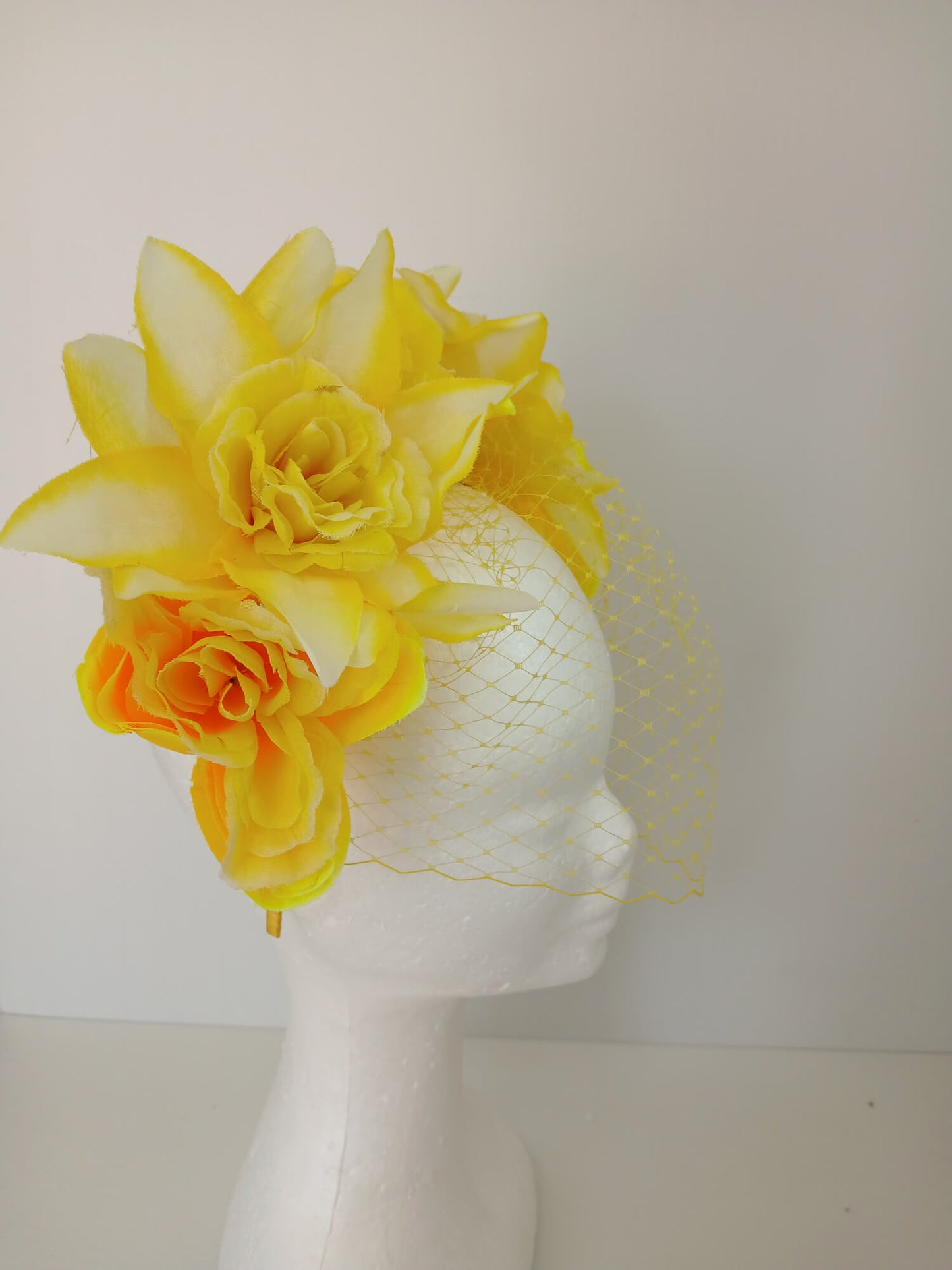 A picture of a Yellow Veiled Headband by Melissa Rath Millinery