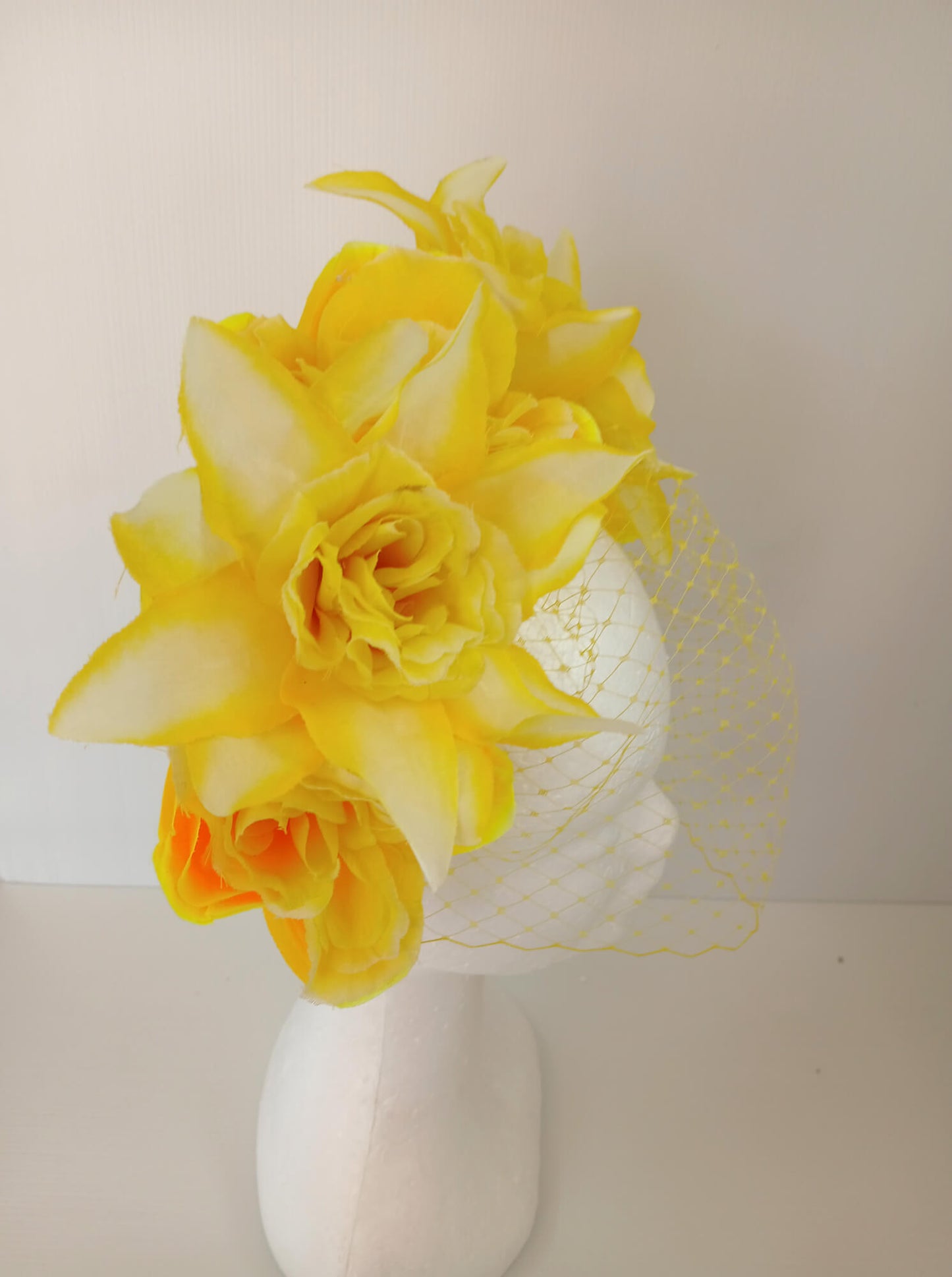 A picture of a Yellow Veiled Headband by Melissa Rath Millinery