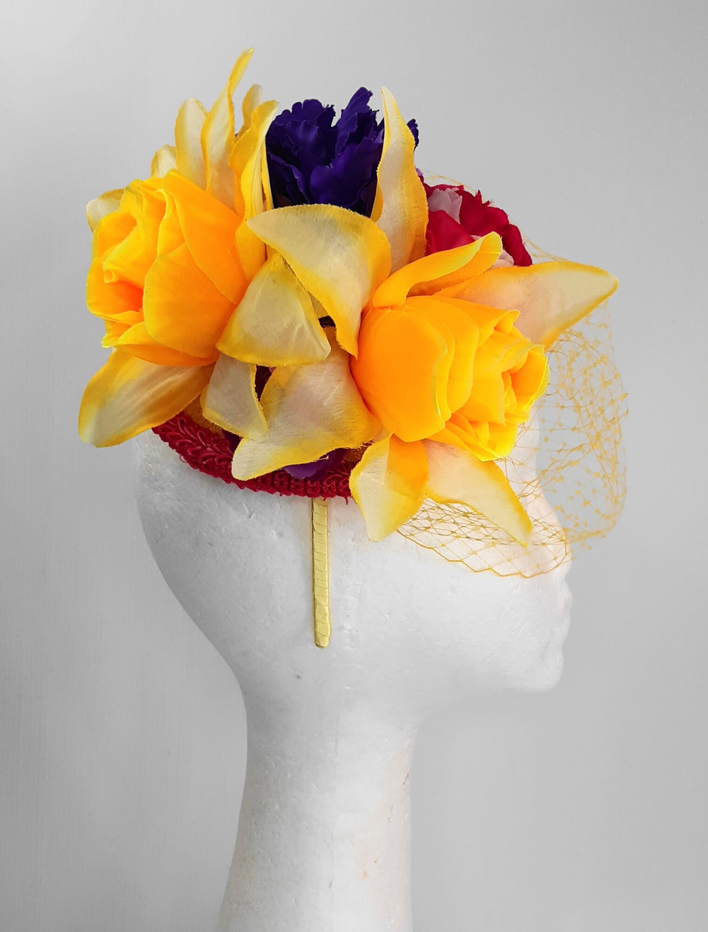 A picture of a Yellow, Pink and Purple Millinery Fascinator by Melissa Rath Millinery.