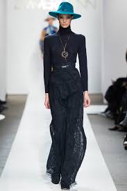 A picture of a model on the catwalk for Zimmerman AW 2015.