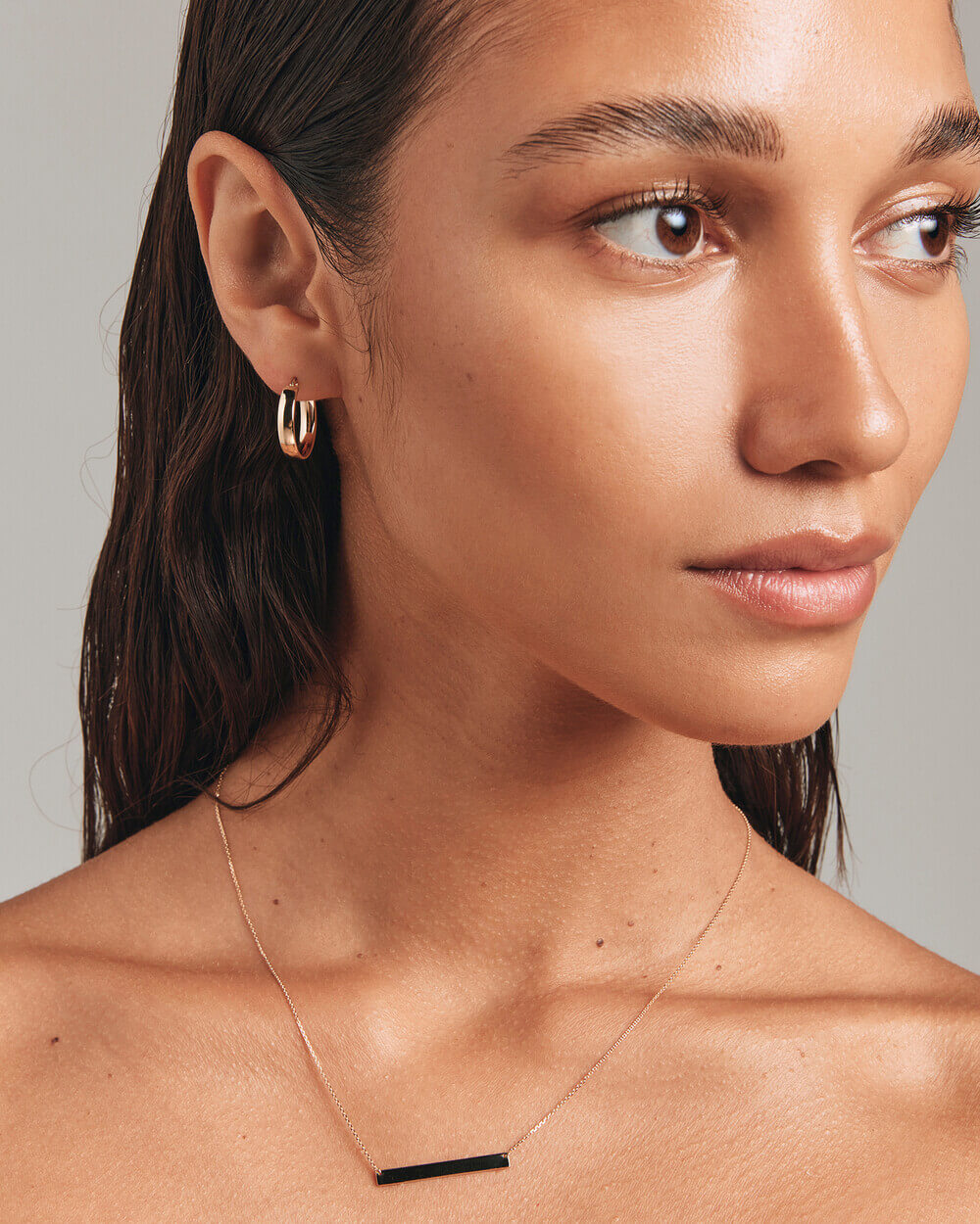 A picture of the 15mm Hoop Earrings in 10kt Yellow Gold, available at Michael Hill