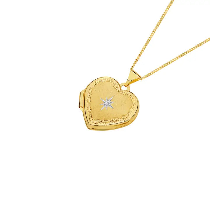 A picture of the 9 ct Gold 18mm Diamond Centre and Border Heart Locket, available at Angus & Coote