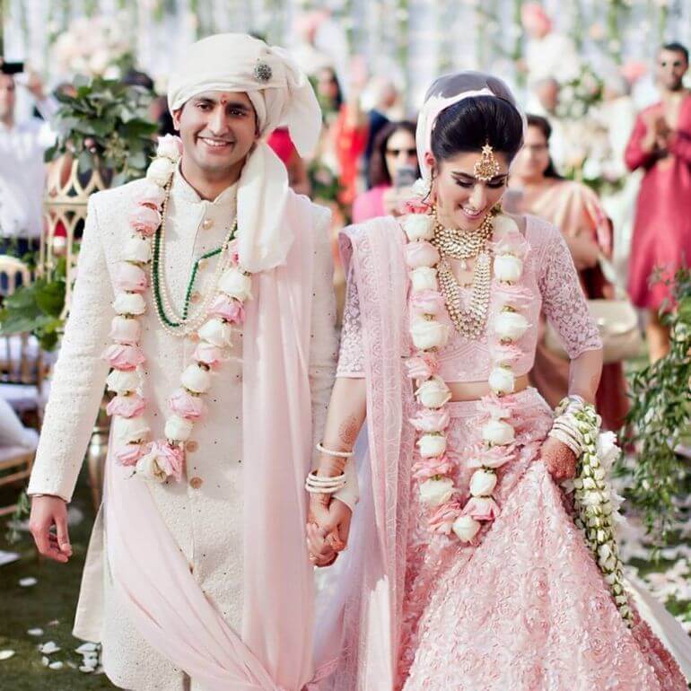 A picture of a newlywed couple at their wedding in India.