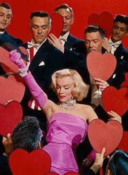 A picture of Marilyn Monroe singing "Diamonds Are a Girls Best Friend" in Gentlemen Prefer Blondes, released in 1953.