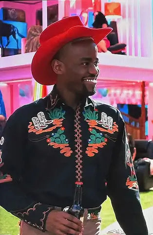 A picture of a Ken doll from the Barbie  Movie wearing a red cowboy hat