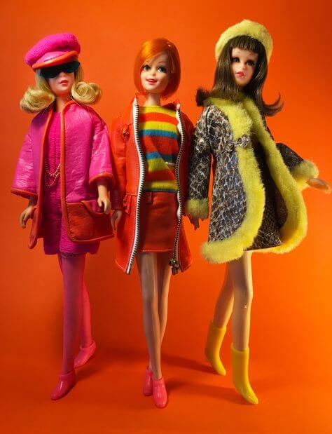 A picture of a collection of Barbie dolls in the 1970s