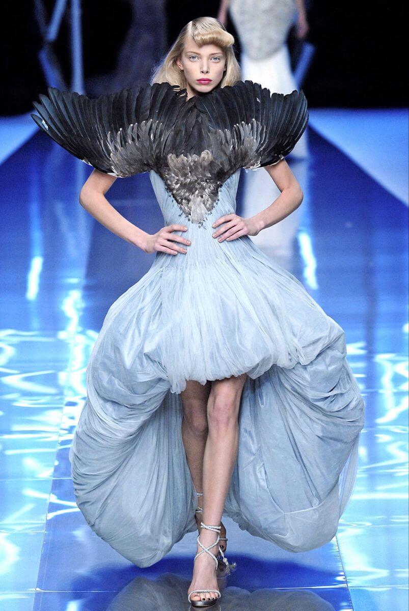 A picture of a model wearing a feathered dress by designer Alexander McQueen