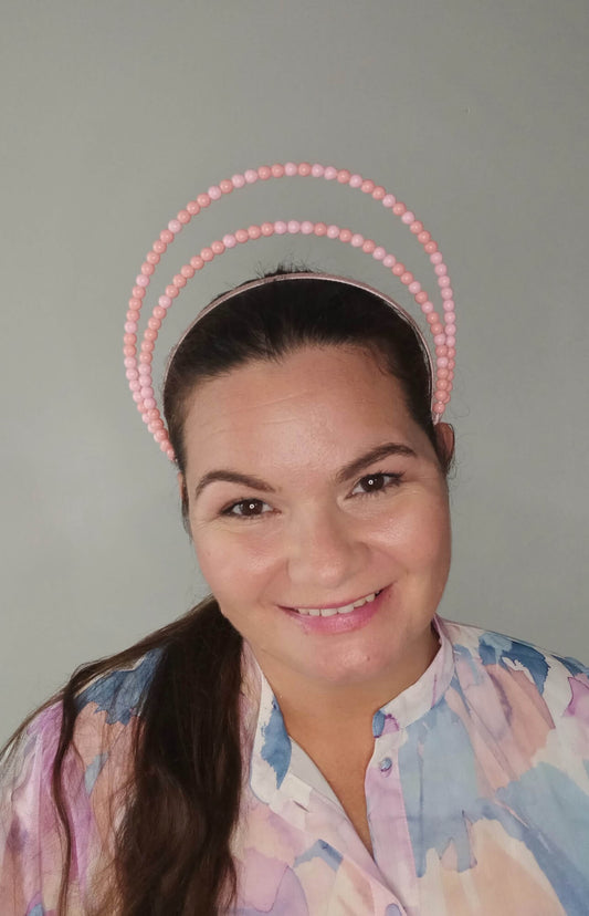 A picture of an Apricot Beaded Headband by Melissa Rath Millinery.
