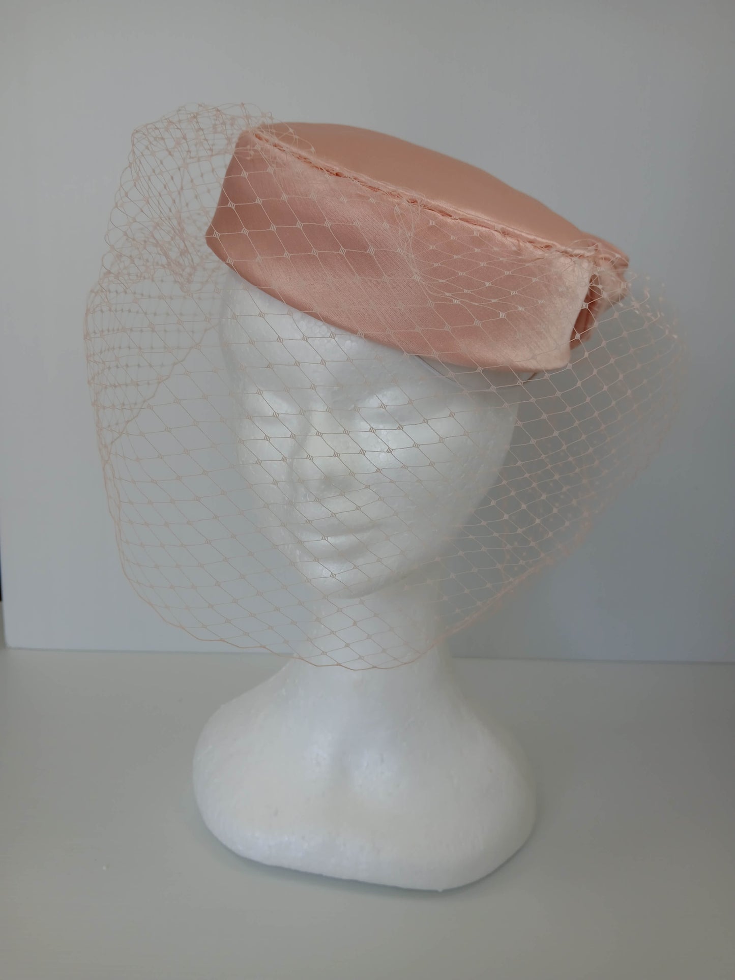 A picture of an Apricot Pillbox by Melissa Rath Millinery