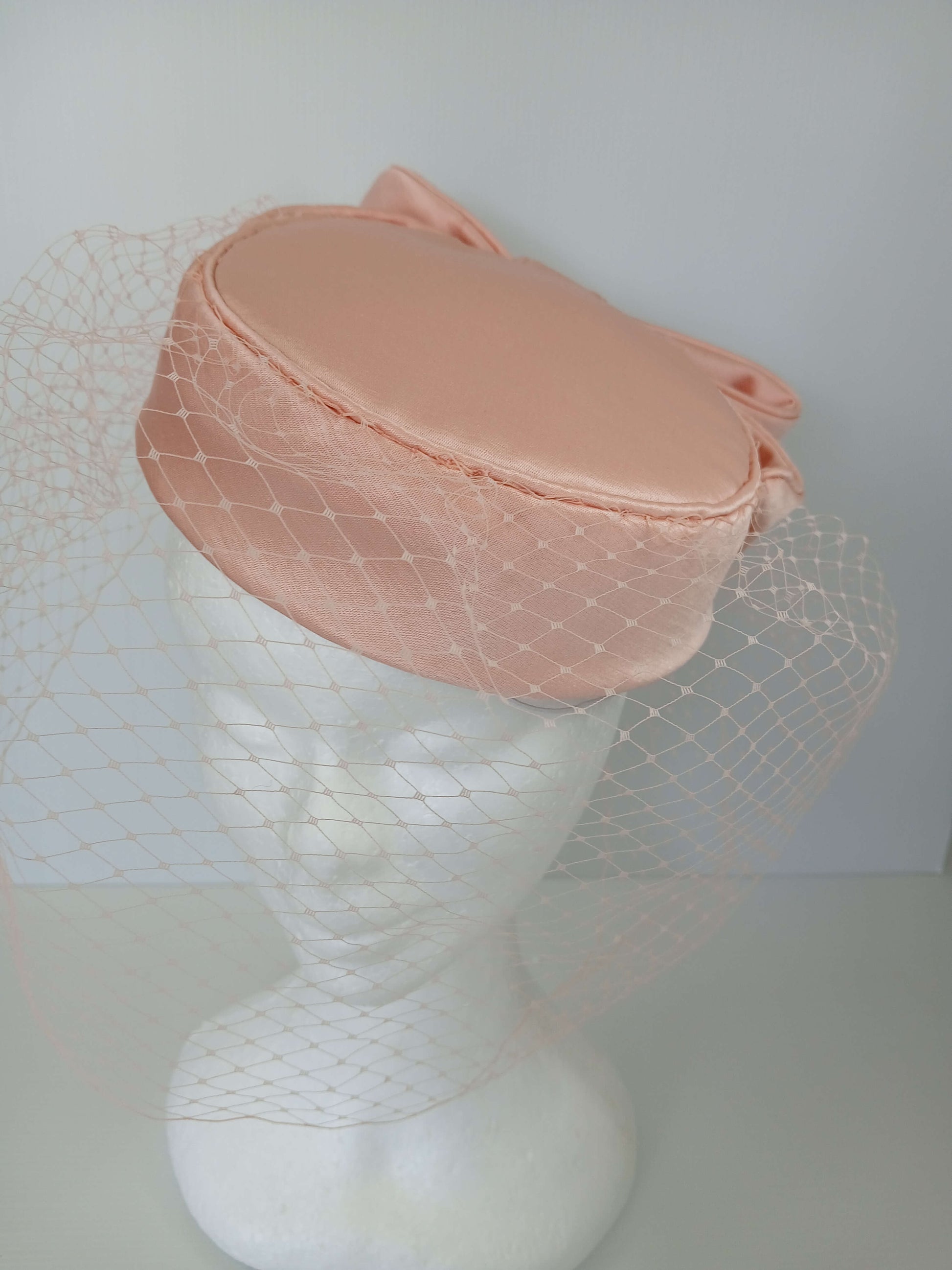 A picture of an Apricot Pillbox by Melissa Rath Millinery