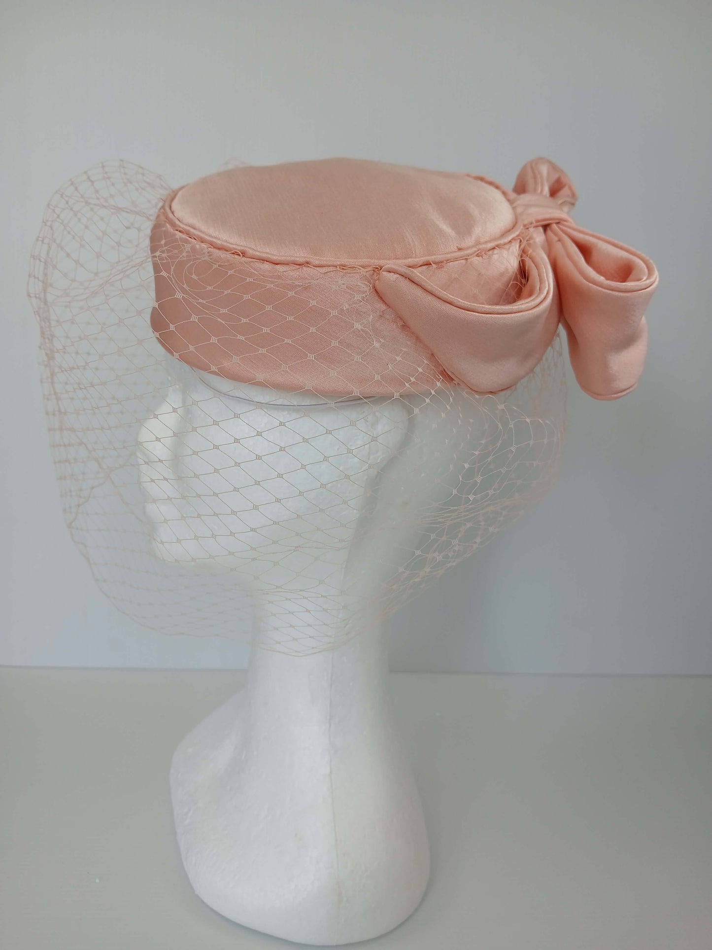 A picture of an Apricot Pillbox by Melissa Rath Millinery