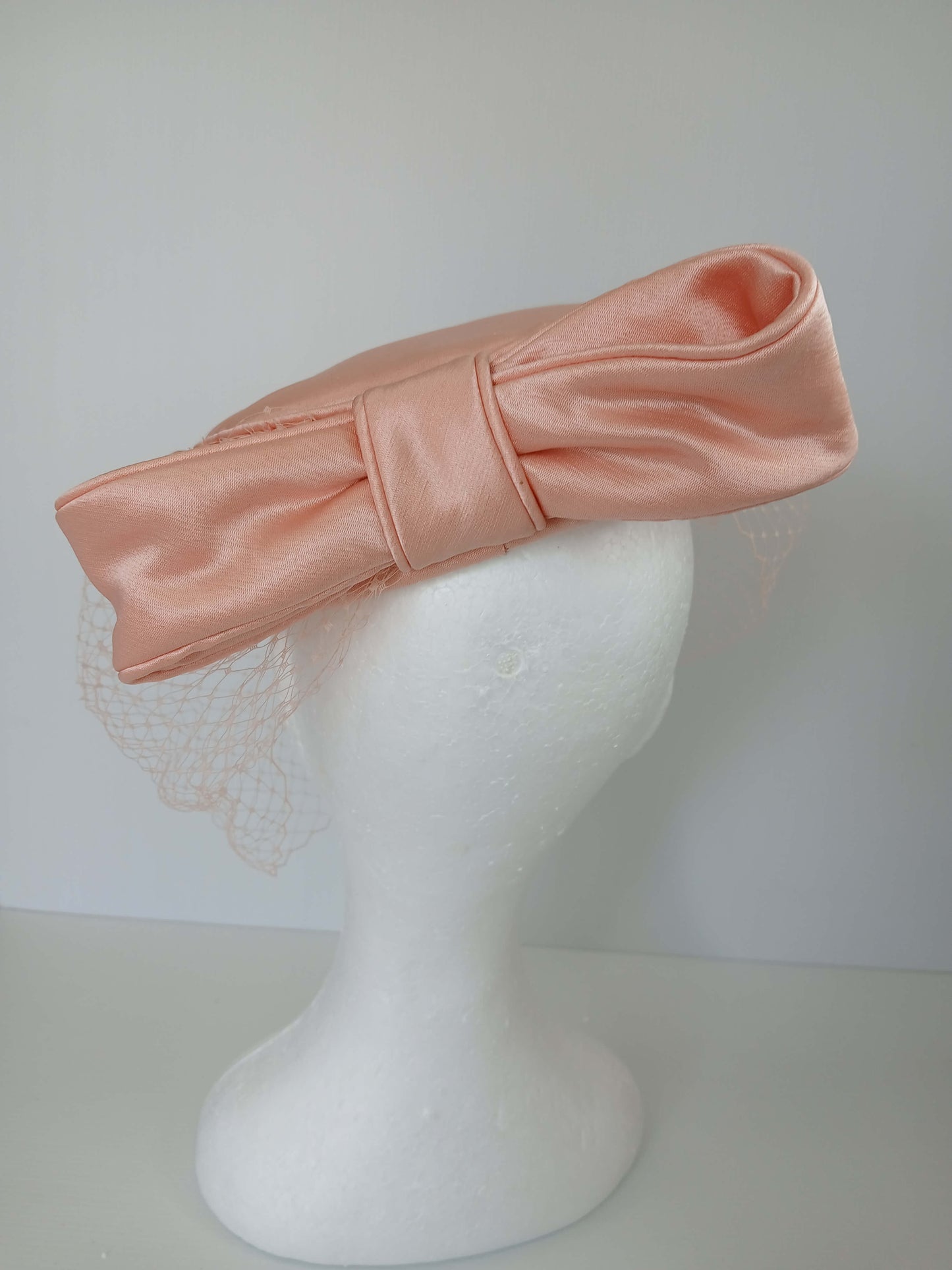 A picture of an Apricot Pillbox by Melissa Rath Millinery