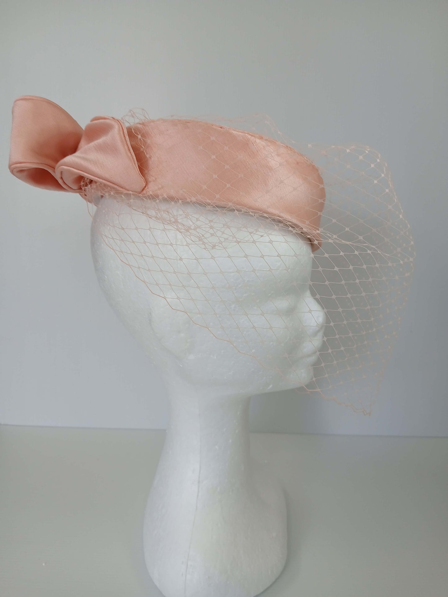 A picture of an Apricot Pillbox by Melissa Rath Millinery