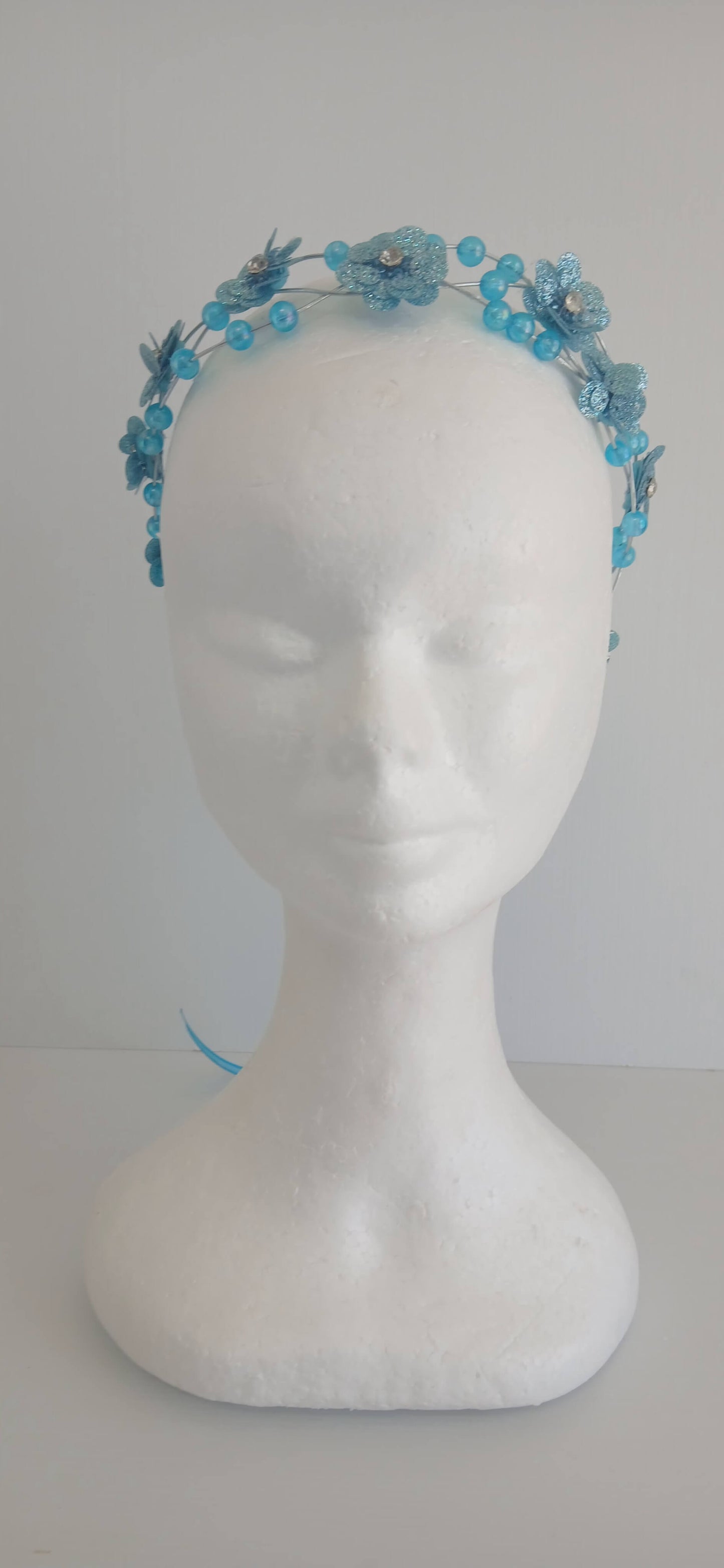 An image of the  Aqua Beaded Halo Crown by Melissa Rath Millinery