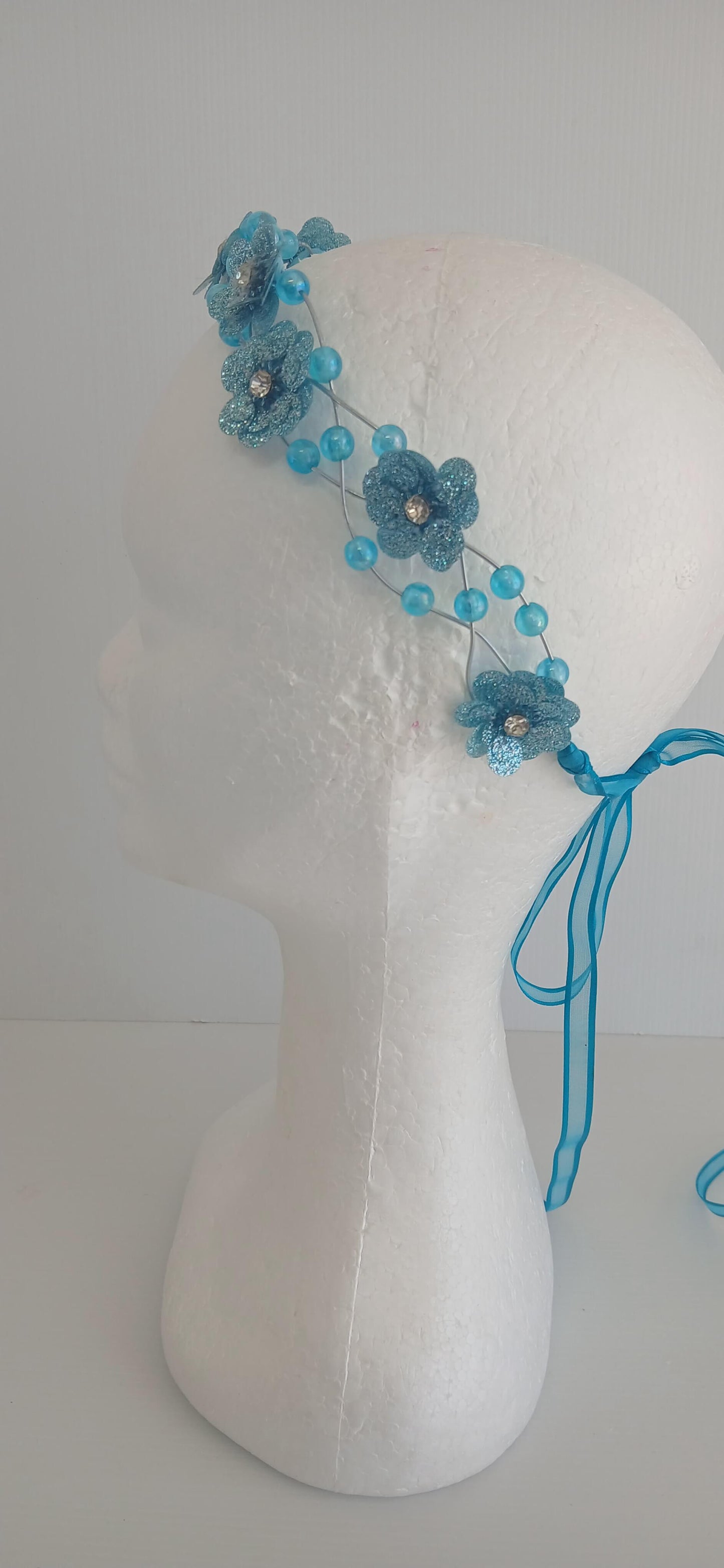 An image of the  Aqua Beaded Halo Crown by Melissa Rath Millinery