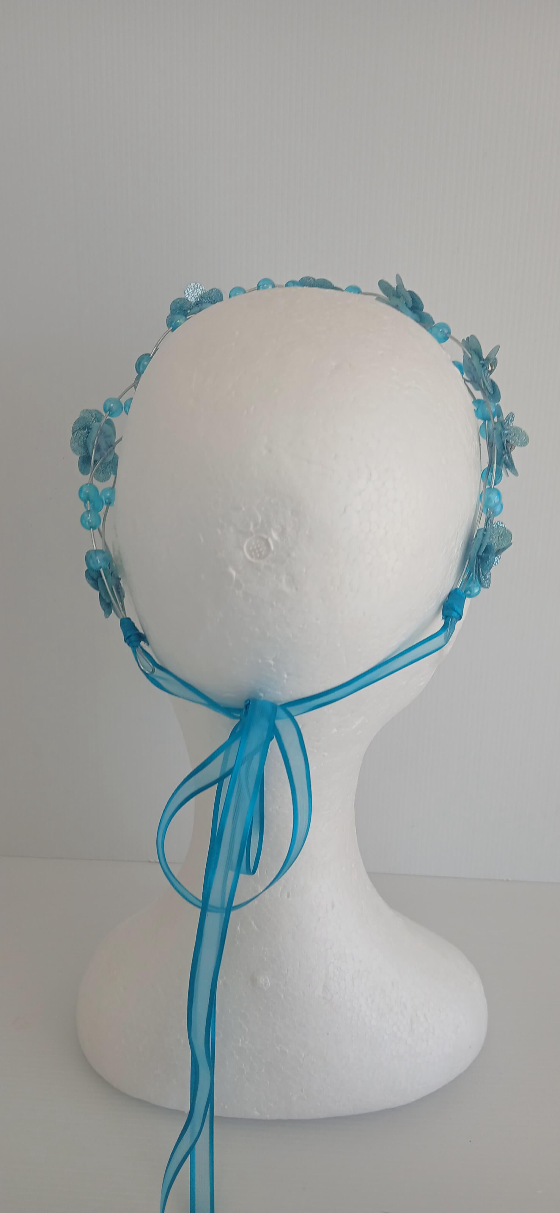 An image of the  Aqua Beaded Halo Crown by Melissa Rath Millinery