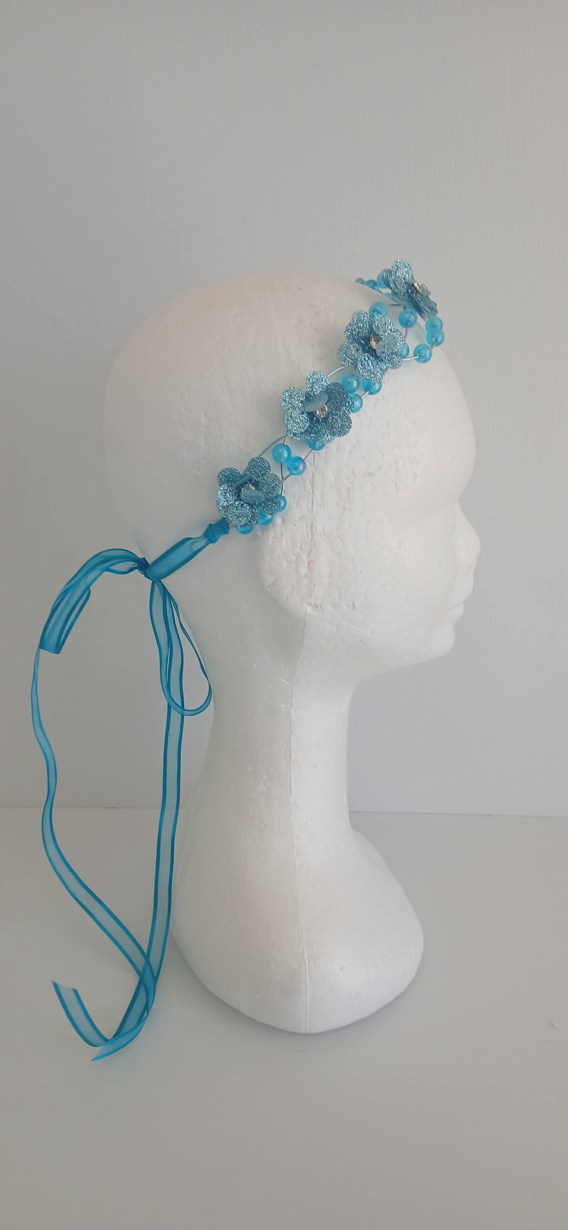 An image of the  Aqua Beaded Halo Crown by Melissa Rath Millinery