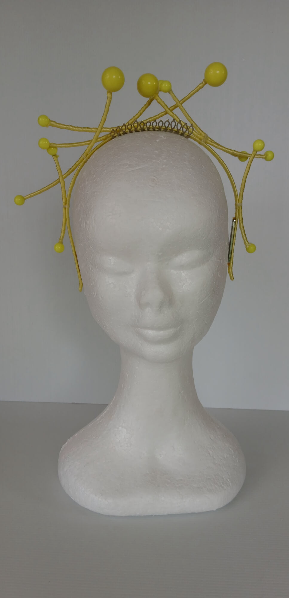 A picture of a yellow beaded  millinery headband by Melissa Rath Millinery.