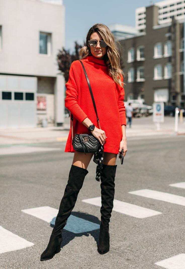 A picture of a woman wearing an outfit with black accents.