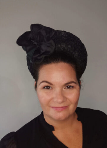 A picture of a Black Lace Millinery Crown by Melissa Rath Millinery.