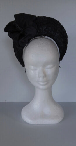 A picture of a Black Lace Millinery Crown by Melissa Rath Millinery.