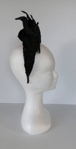 A picture of a Black Lace Millinery Crown by Melissa Rath Millinery.