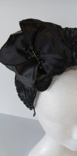 A picture of a Black Lace Millinery Crown by Melissa Rath Millinery.