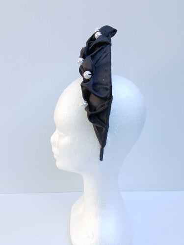 An image of a Black Smocked Satin Crown by Melissa Rath Millinery
