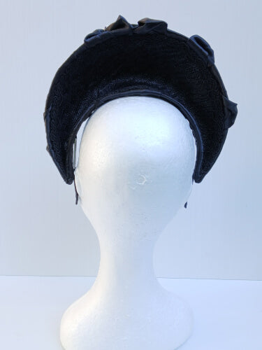 An image of a Black Smocked Satin Crown by Melissa Rath Millinery